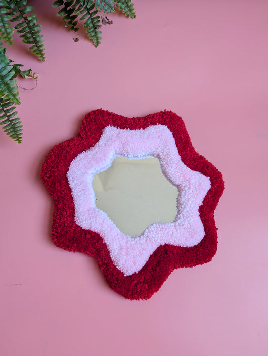 Bright red and pink coloured wavy pattern tufted yarn mirror