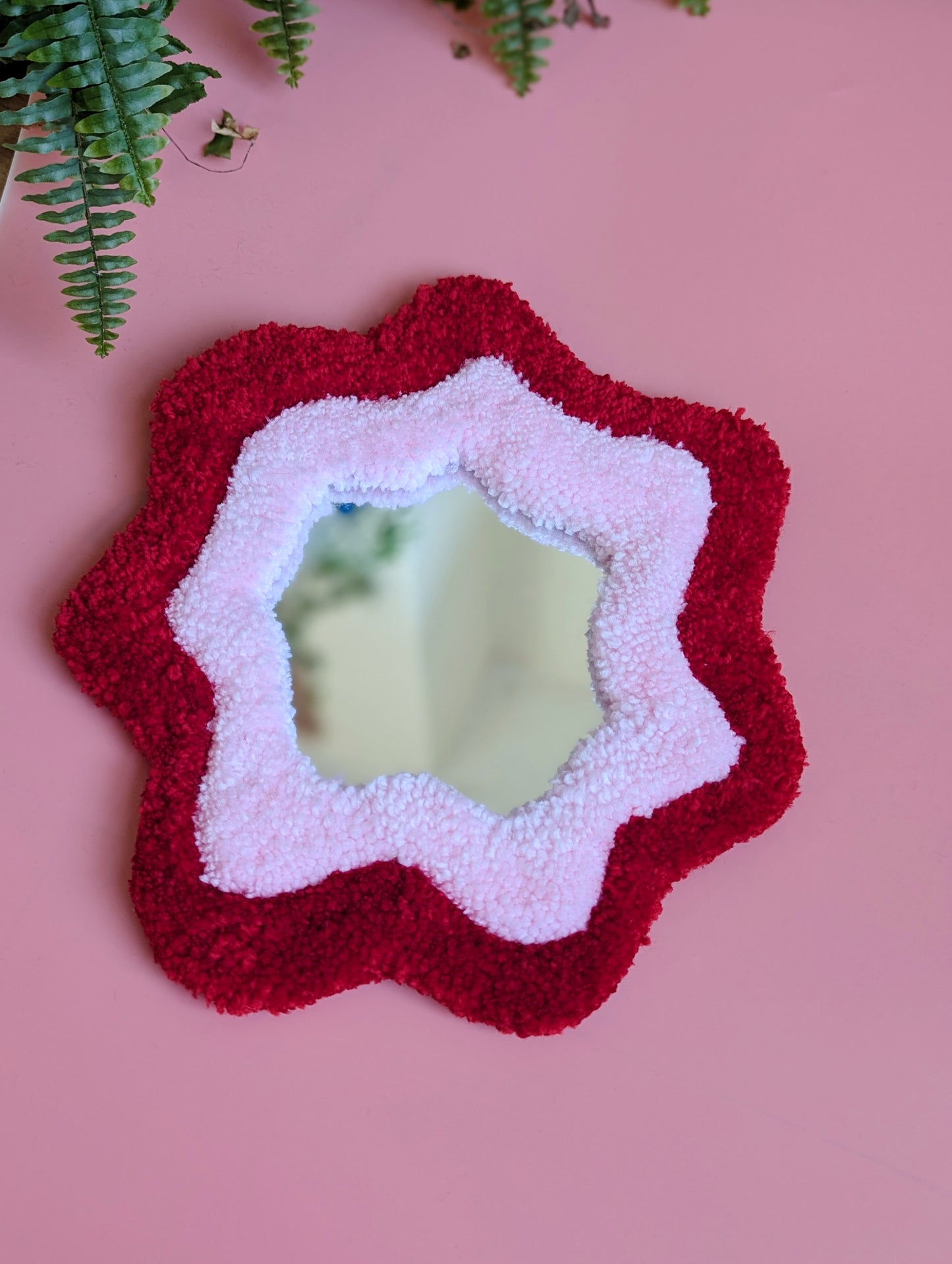 Bright red and pink coloured wavy pattern tufted yarn mirror