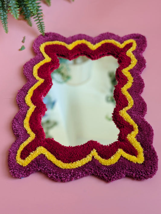 Pink, yellow and red coloured wavy pattern tufted yarn mirror