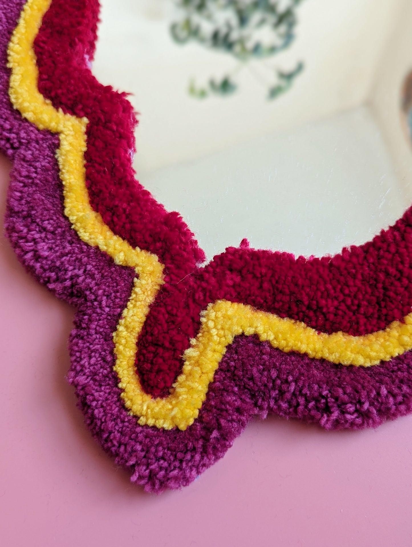 Pink, yellow and red coloured wavy pattern tufted yarn mirror