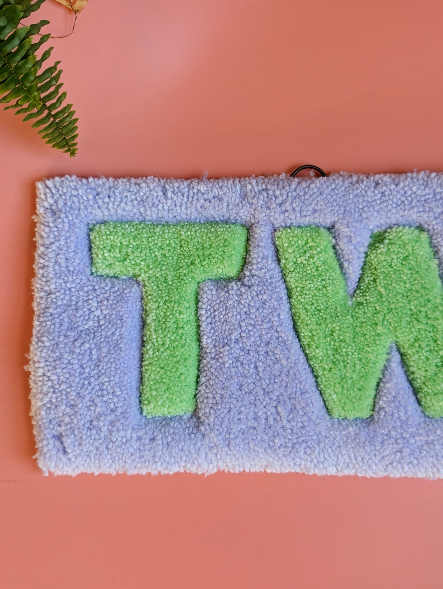 Purple and green tw*t tufted yarn wallhanging rug