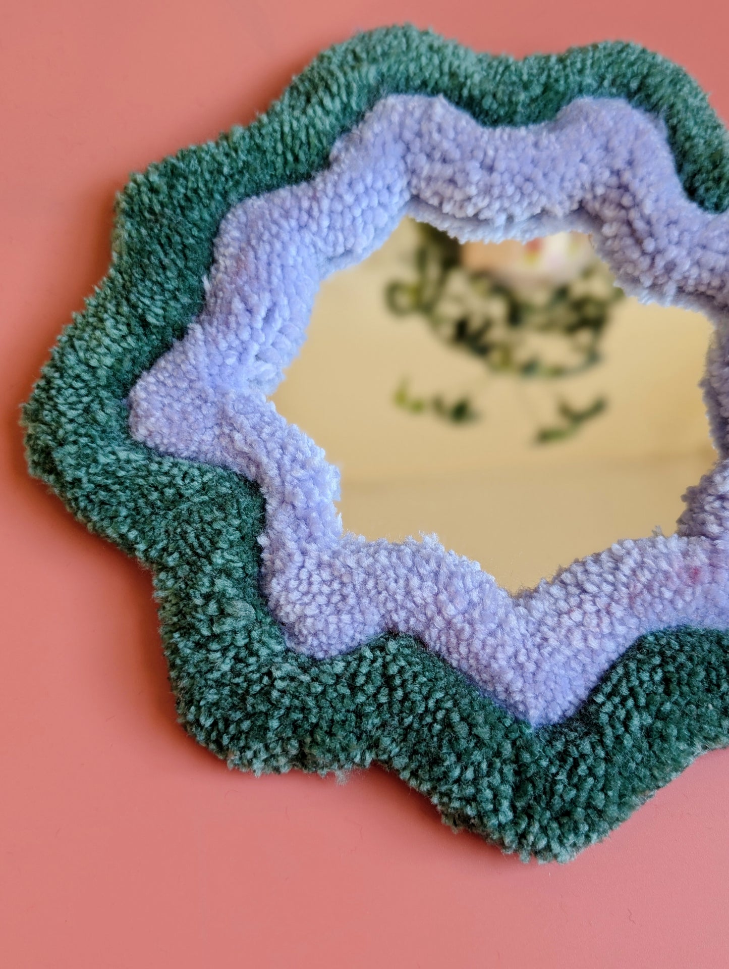 Teal and purple coloured wavy pattern tufted yarn mirror