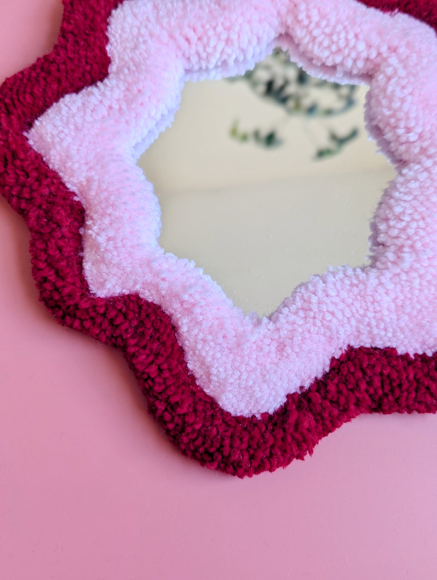 Red and pink coloured wavy pattern tufted yarn mirror