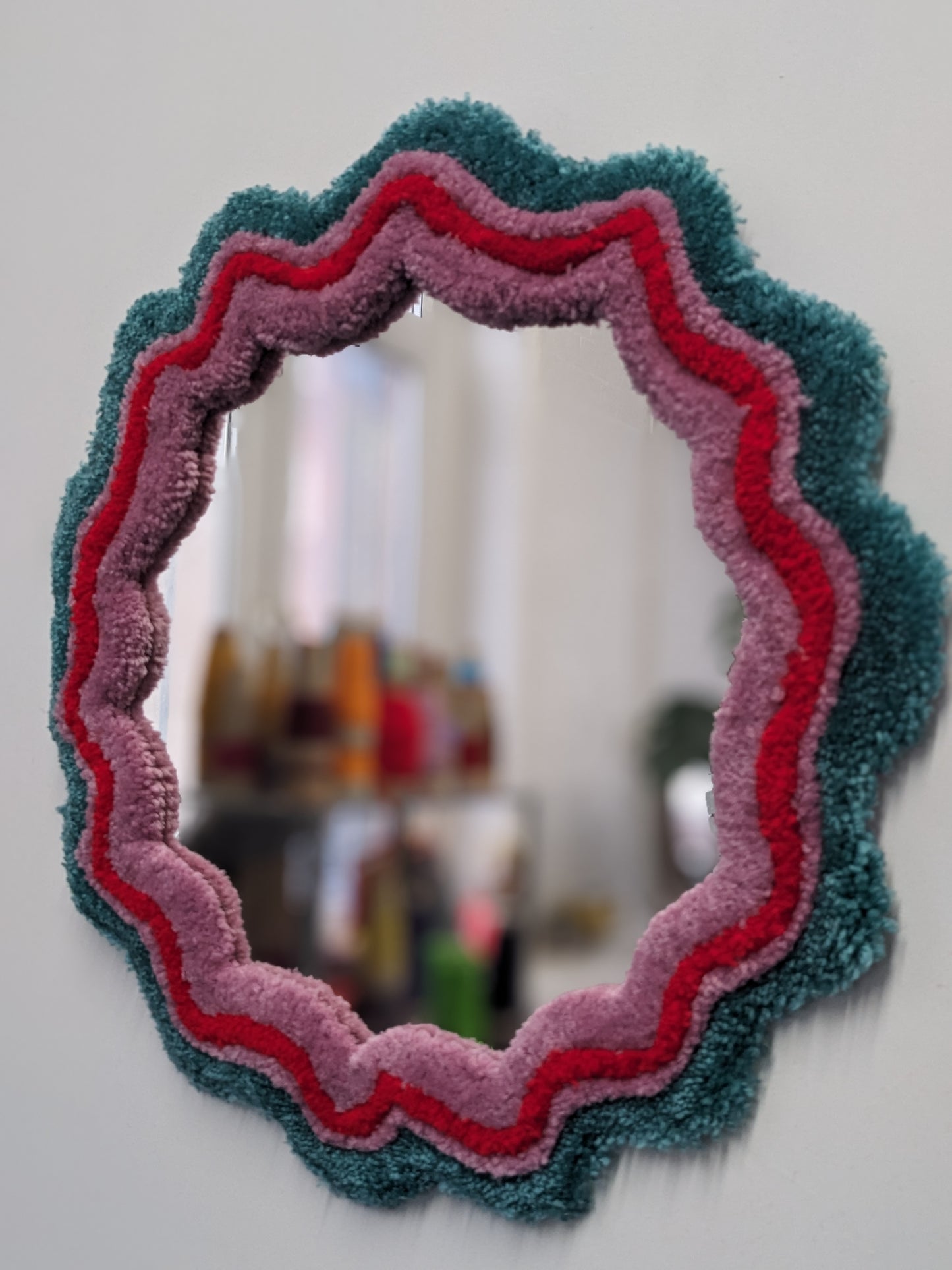 circle red green coloured wavy pattern tufted yarn mirror