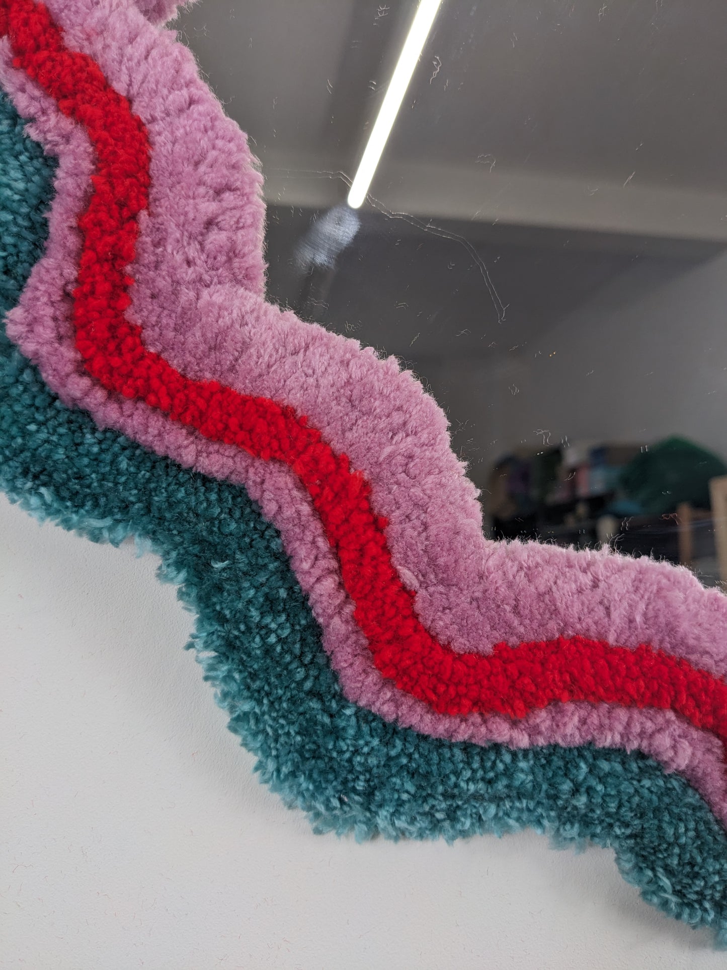 circle red green coloured wavy pattern tufted yarn mirror