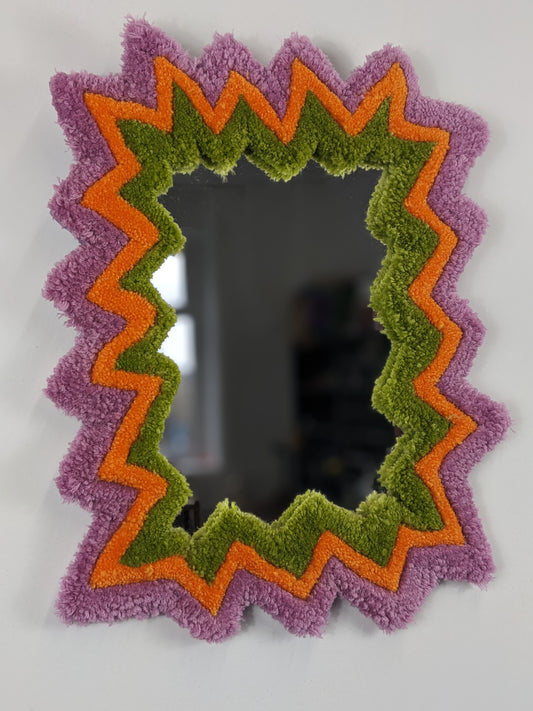 pink orange coloured zigzag pattern tufted yarn mirror