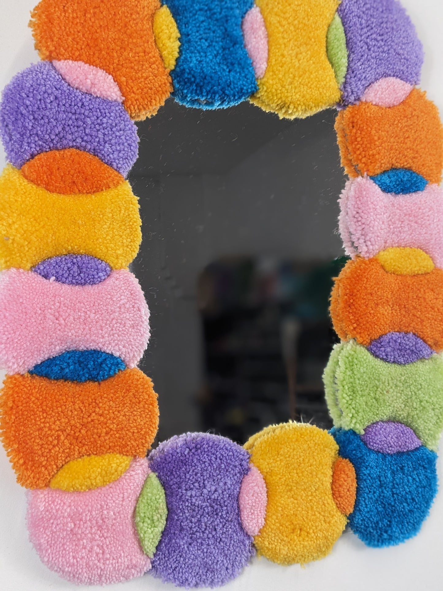 multicoloured orange pastel circle shape pattern yarn tufted mirror