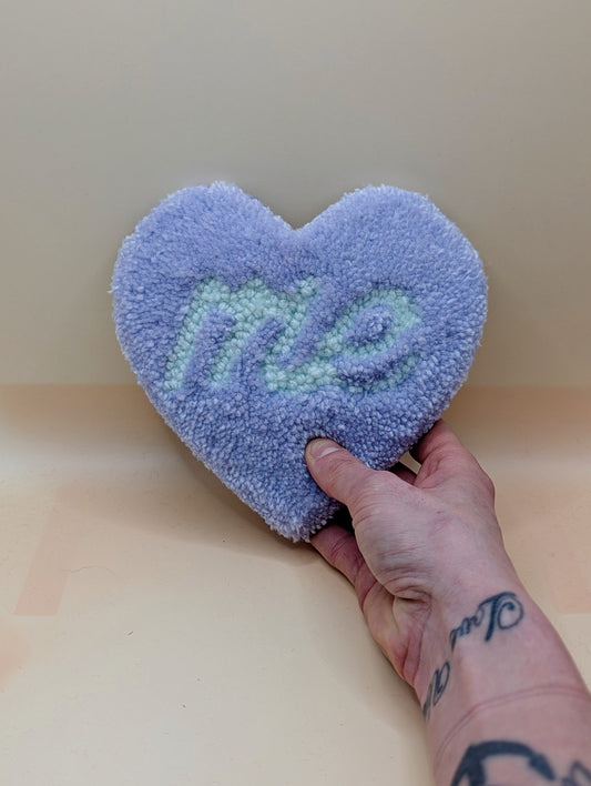 Soft tufted purple and green heart shaped mini rug/coaster with self love slogan