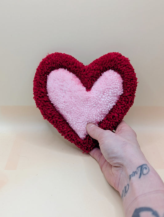 Soft tufted red and pink heart shaped mini rug/coaster 