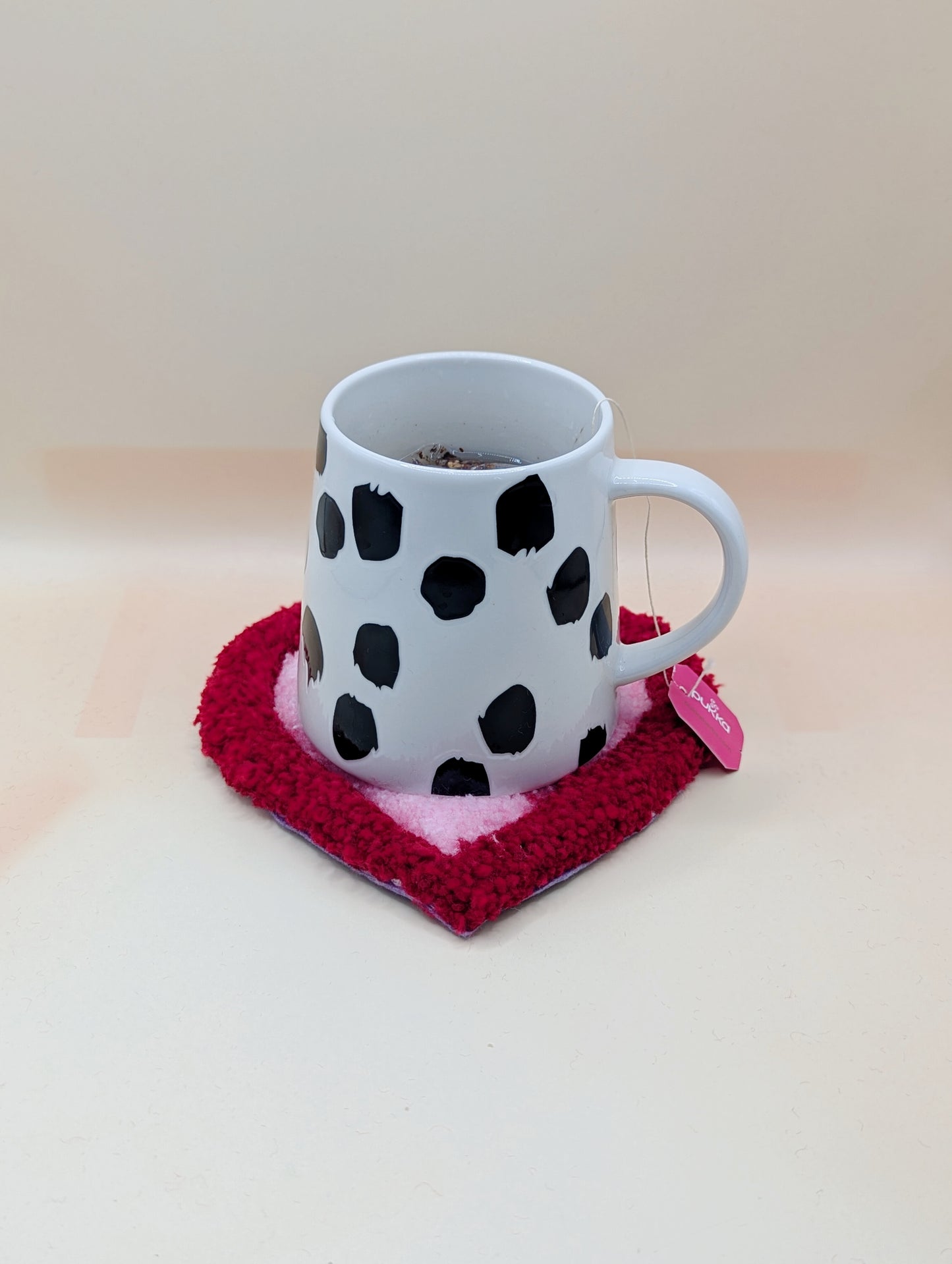 Soft tufted red and pink heart shaped mini rug/coaster 