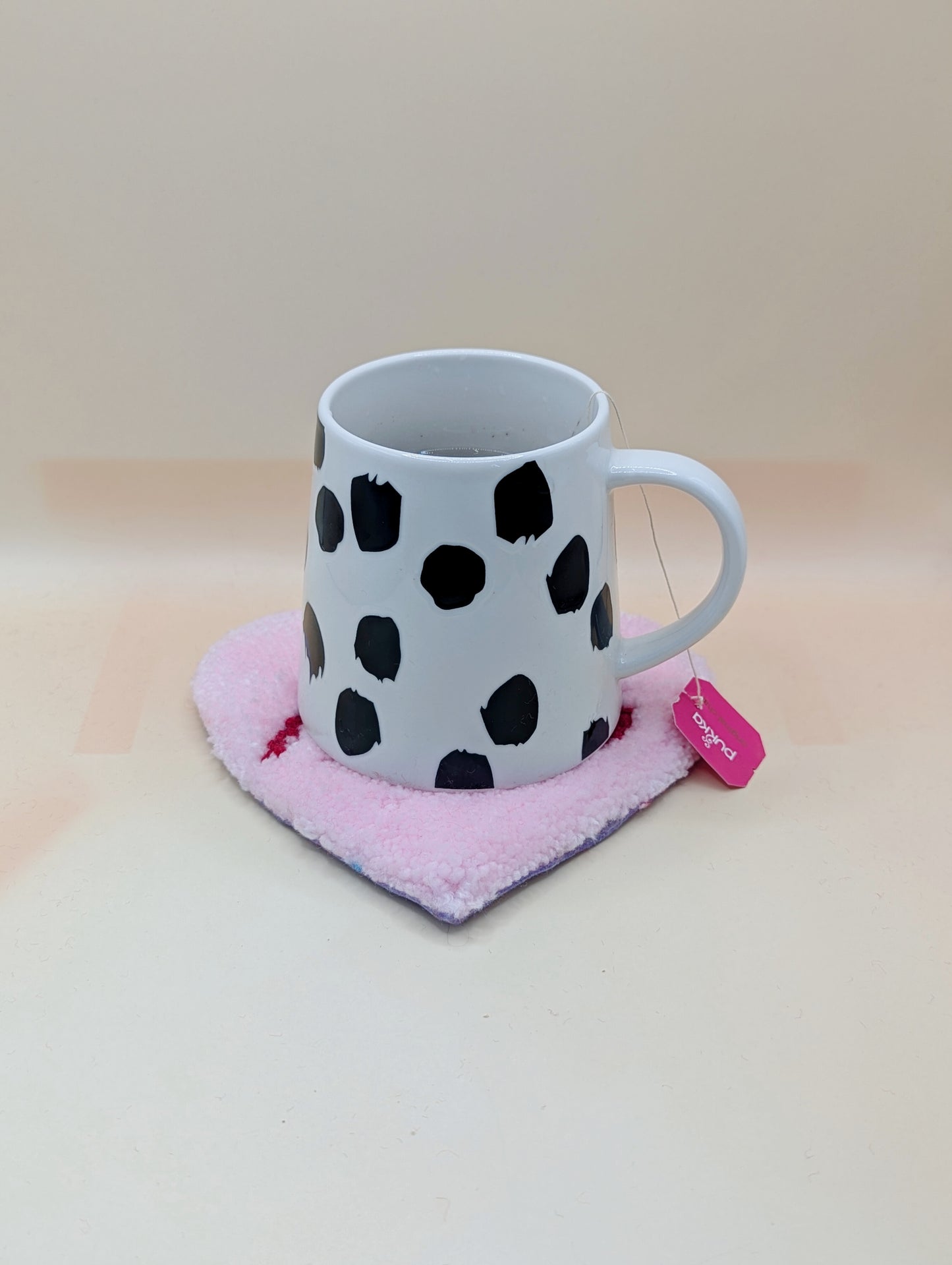 Soft tufted pink and red heart shaped mini rug/coaster with self love slogan