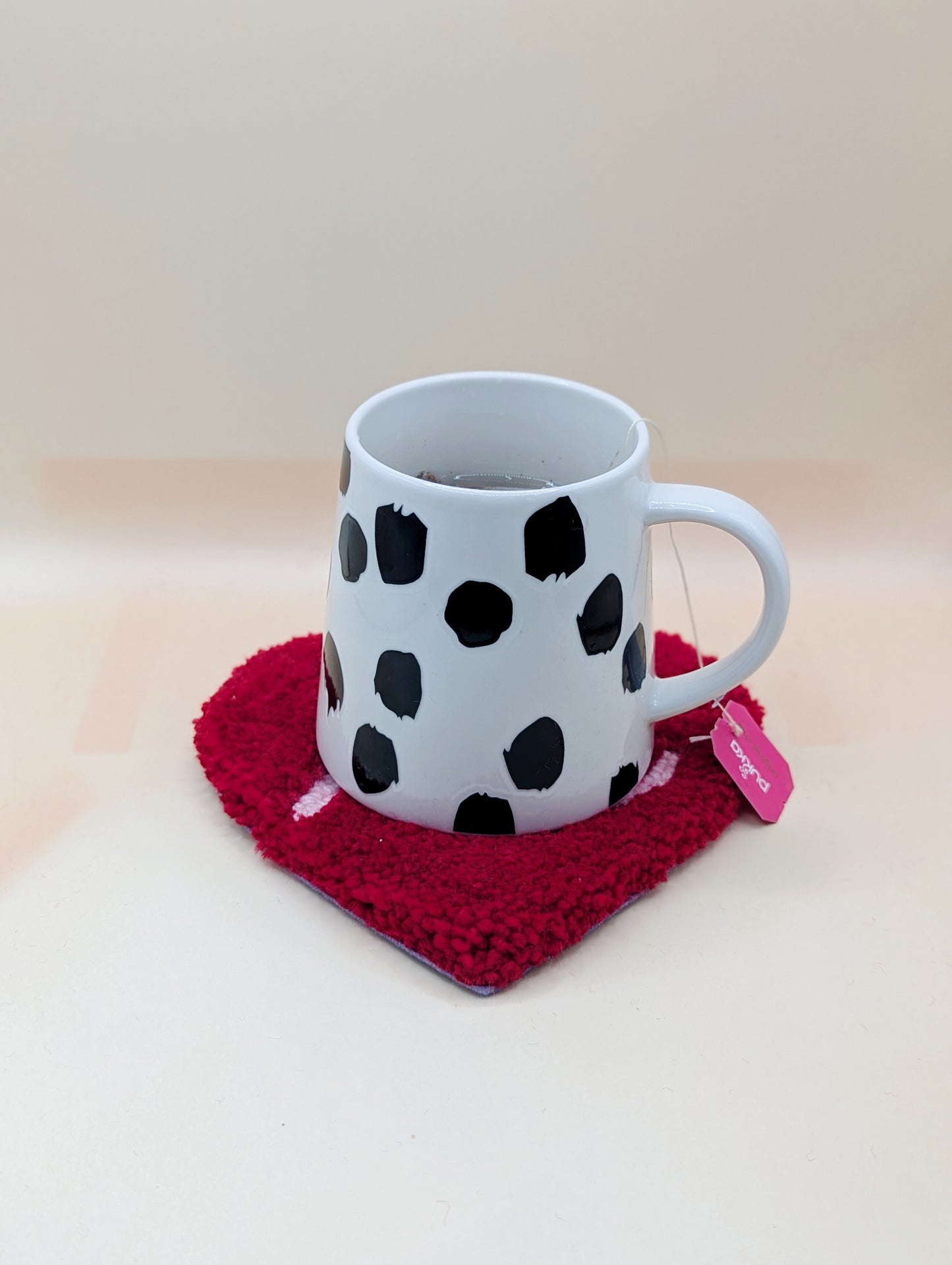 Soft tufted red and pink heart shaped mini rug/coaster with self love slogan