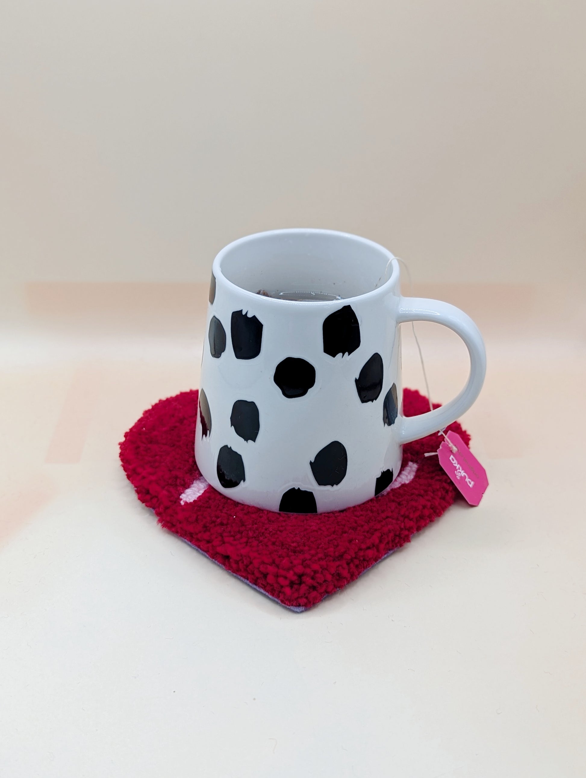 Soft tufted red and pink heart shaped mini rug/coaster with self love slogan