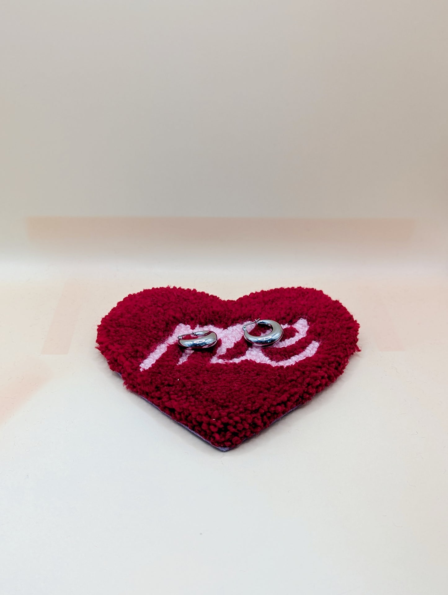 Soft tufted red and pink heart shaped mini rug/coaster with self love slogan