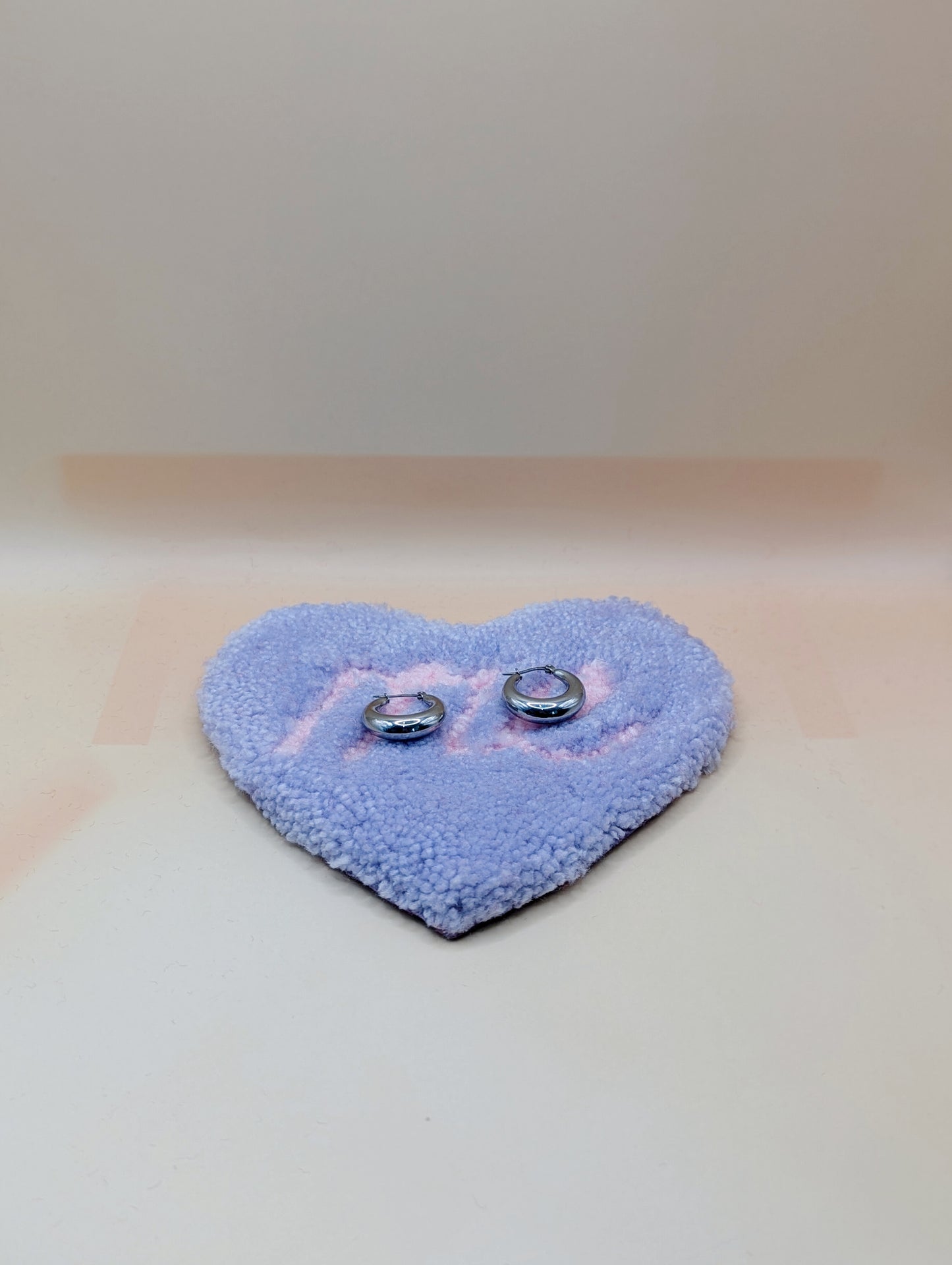 Soft tufted purple and pink heart shaped mini rug/coaster with self love slogan