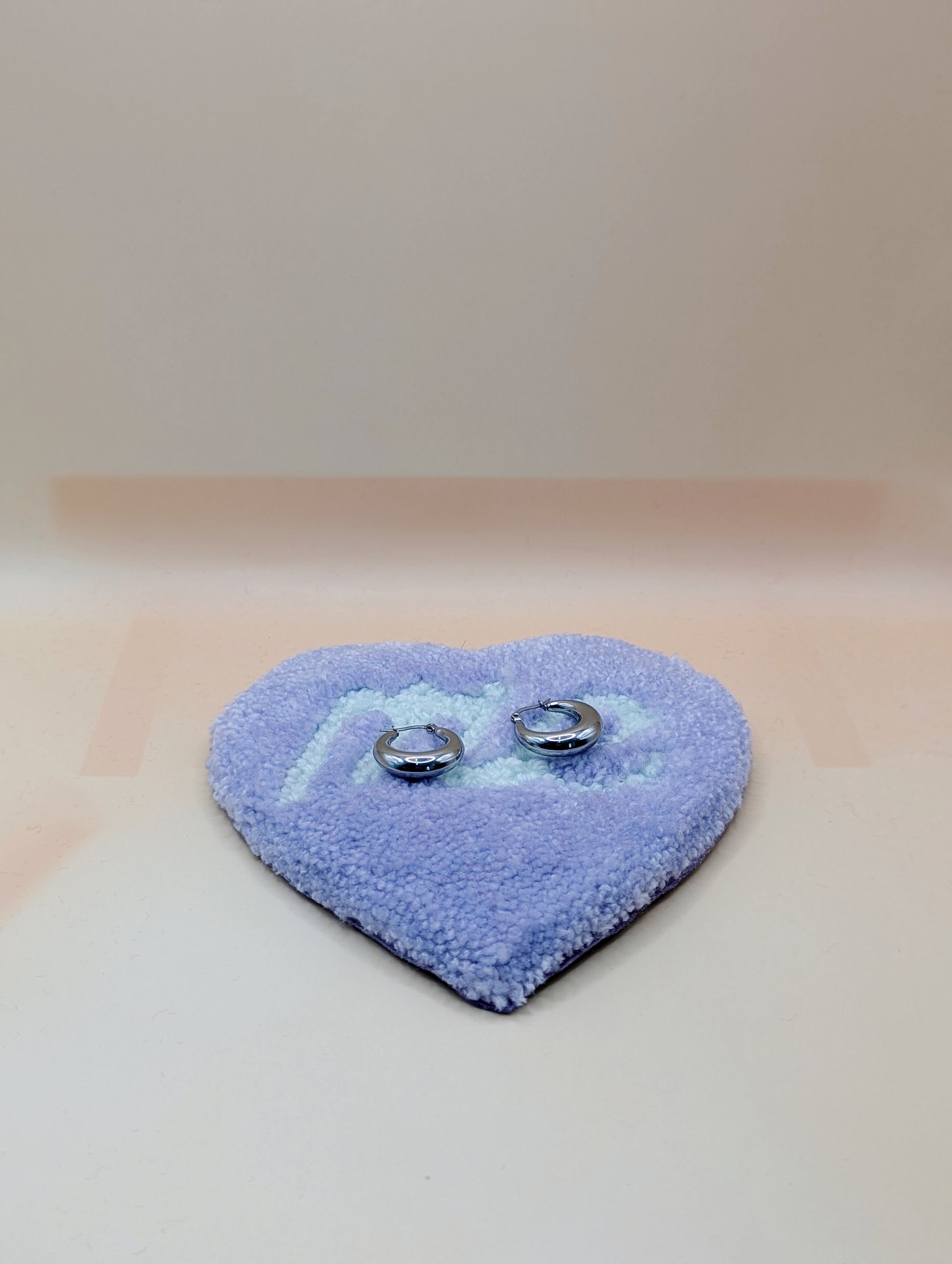 Soft tufted purple and green heart shaped mini rug/coaster with self love slogan