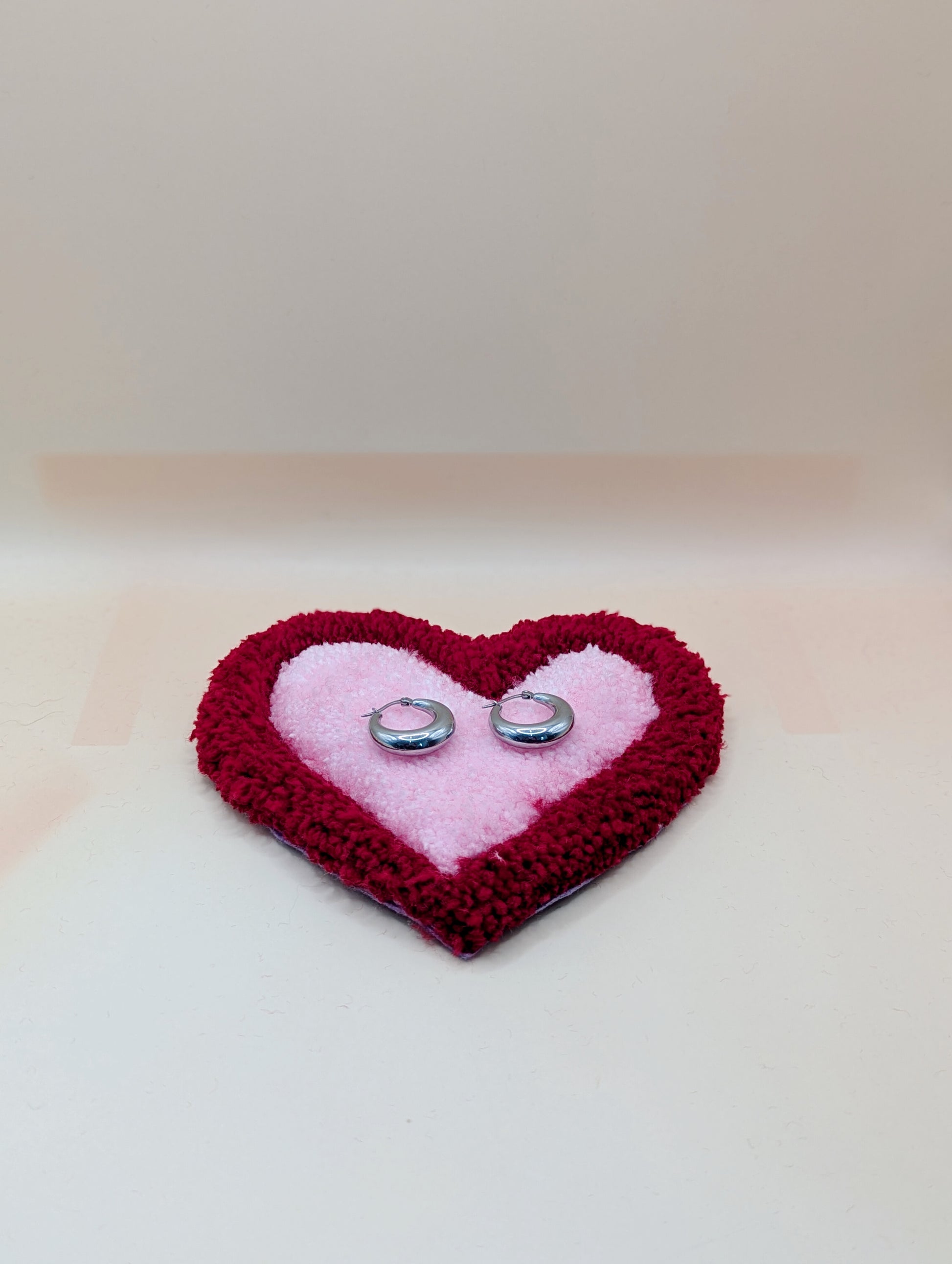 Soft tufted red and pink heart shaped mini rug/coaster 