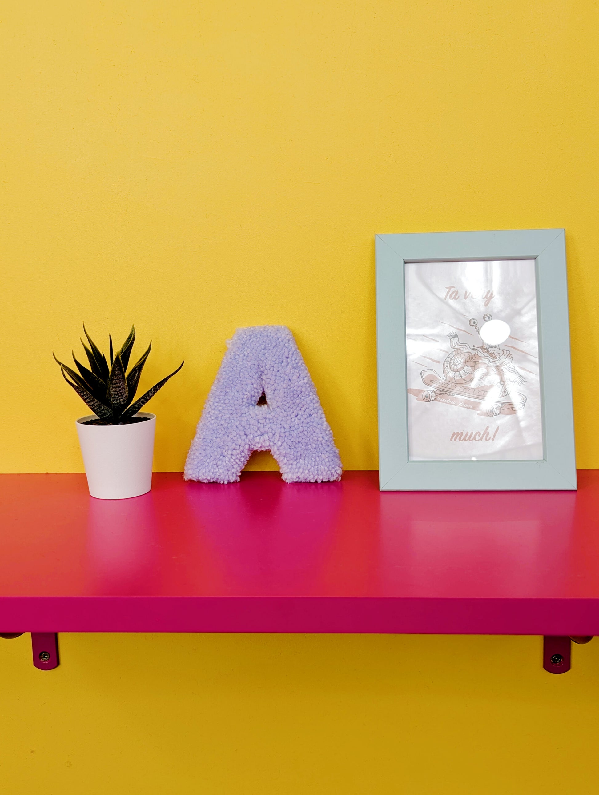 Soft tufted light purple letter A with metal hook for easy hanging