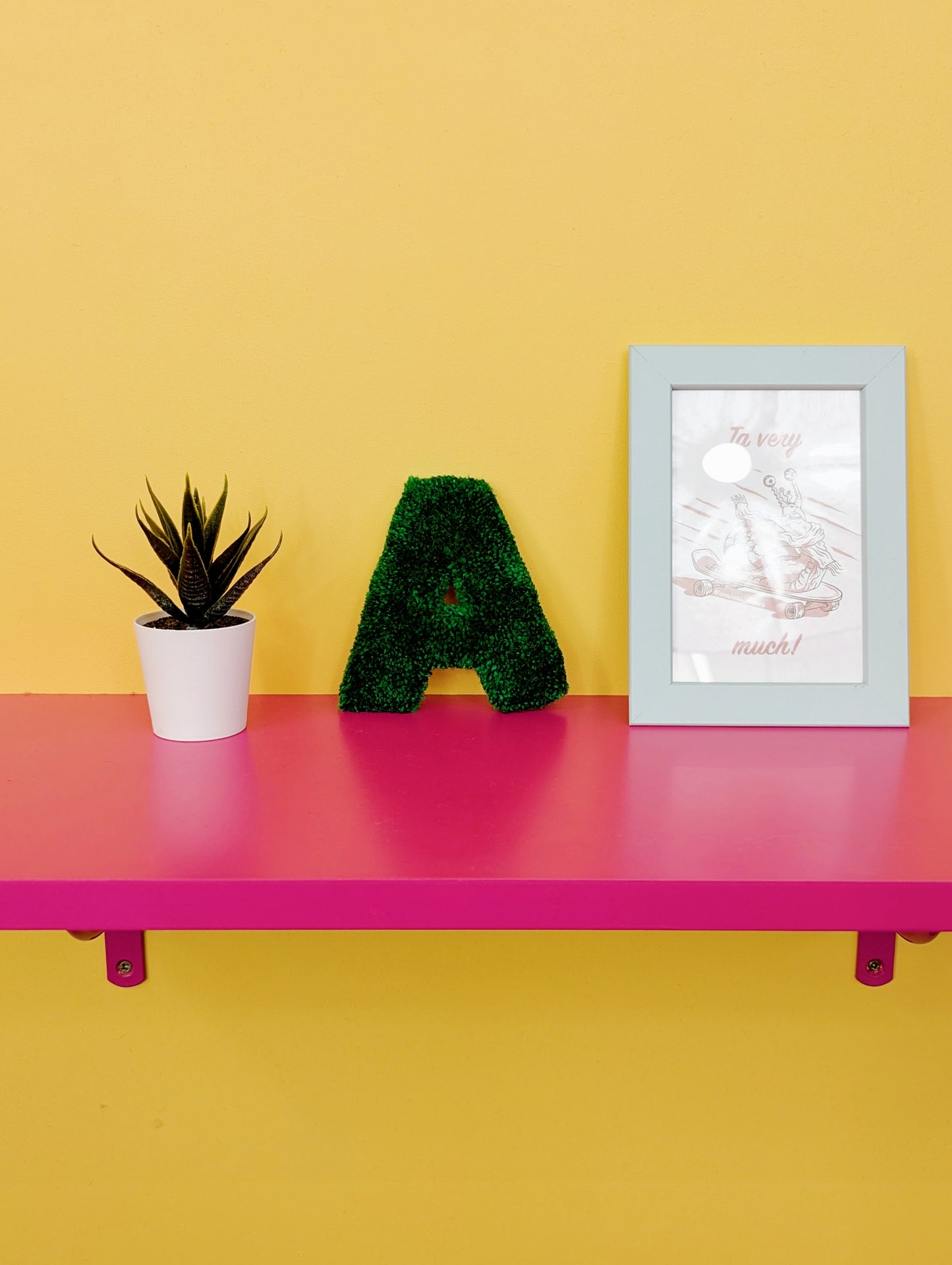 Soft tufted green letter A with metal hook for easy hanging