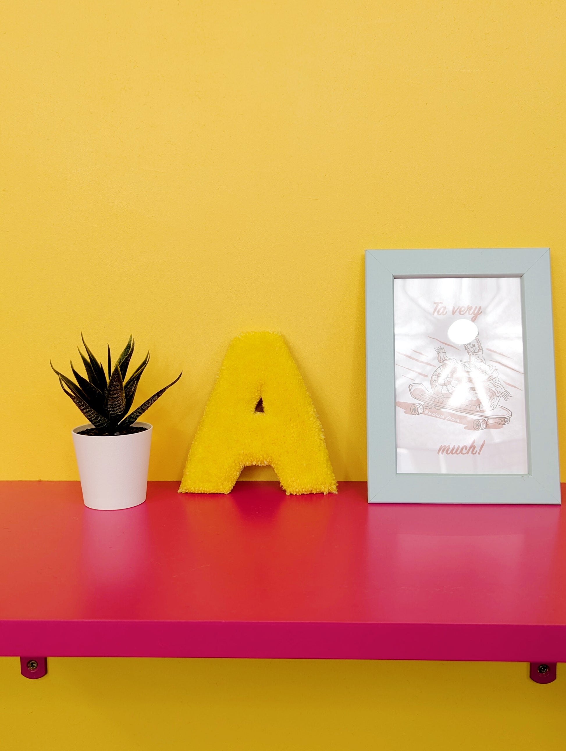 Soft tufted yellow letter A with metal hook for easy hanging