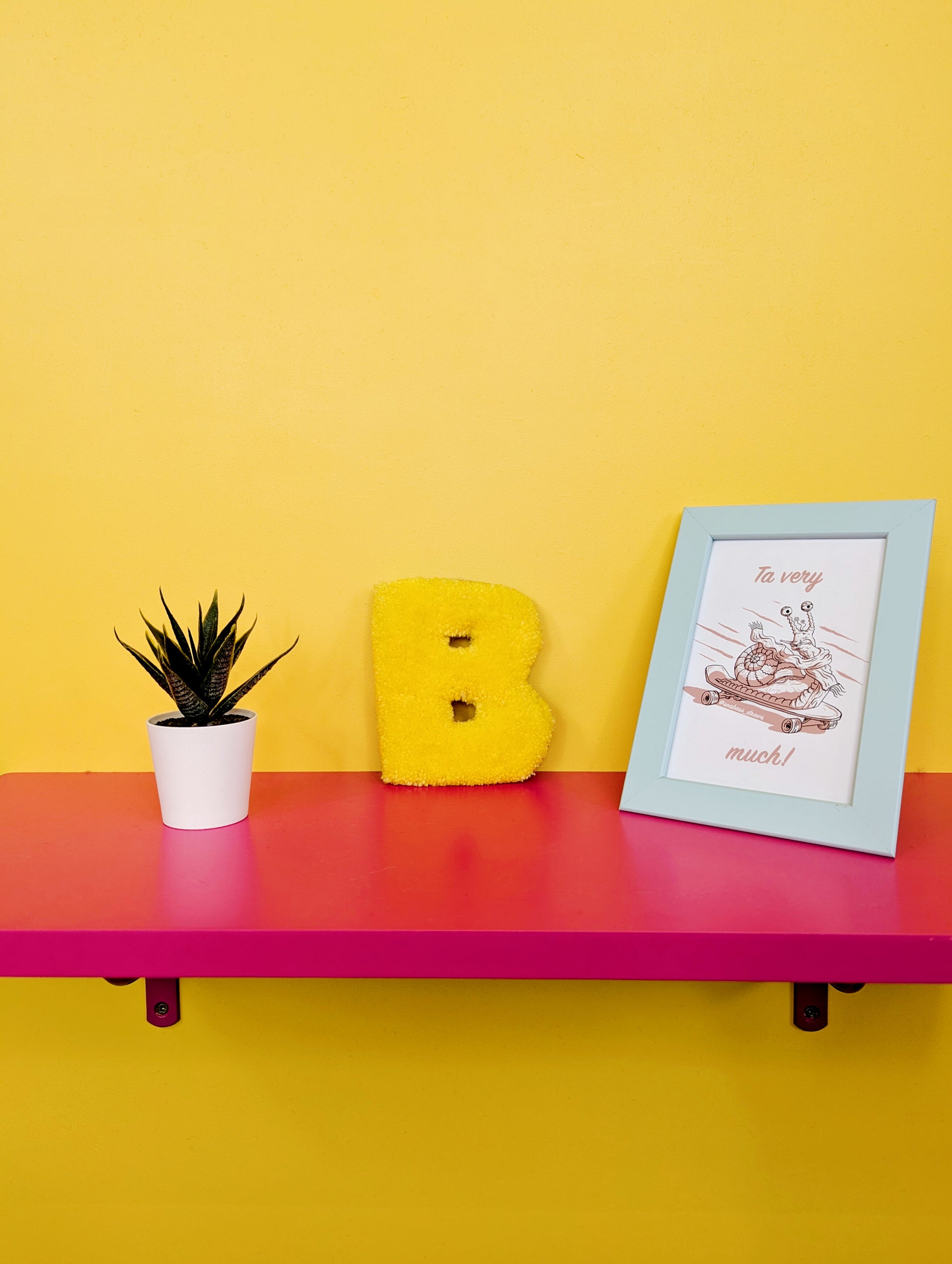 Soft tufted yellow letter B with metal hook for easy hanging