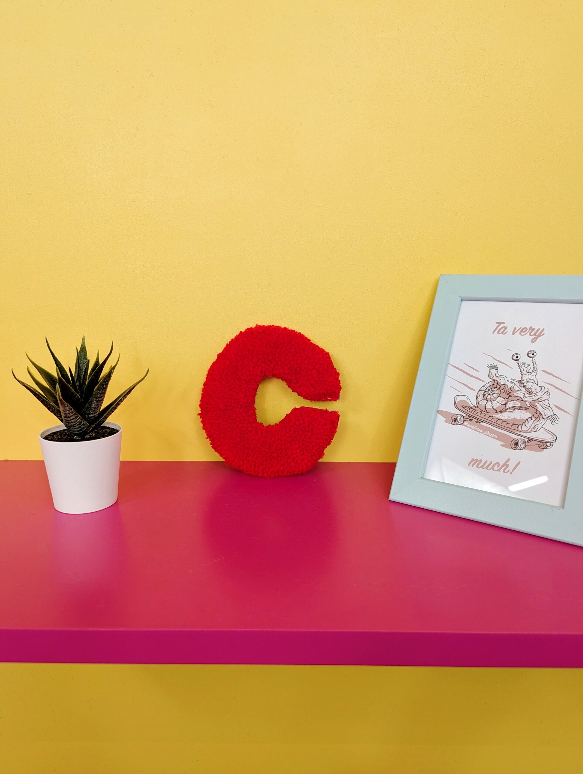 Soft tufted red letter C with metal hook for easy hanging