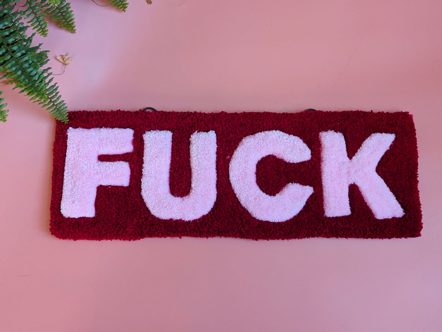 Red and pink f*ck tufted yarn wallhanging rug