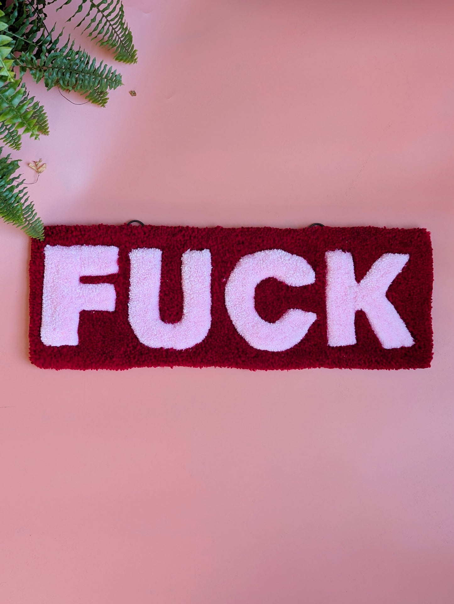 Red and pink f*ck tufted yarn wallhanging rug