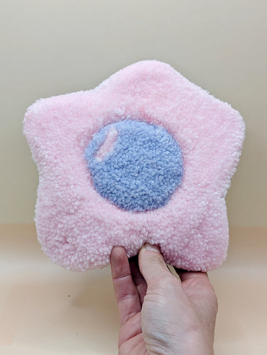 Soft tufted pink and purple fried egg shaped mini rug/coaster 