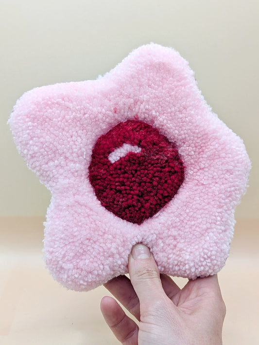 Soft tufted red and pink fried egg shaped mini rug/coaster 