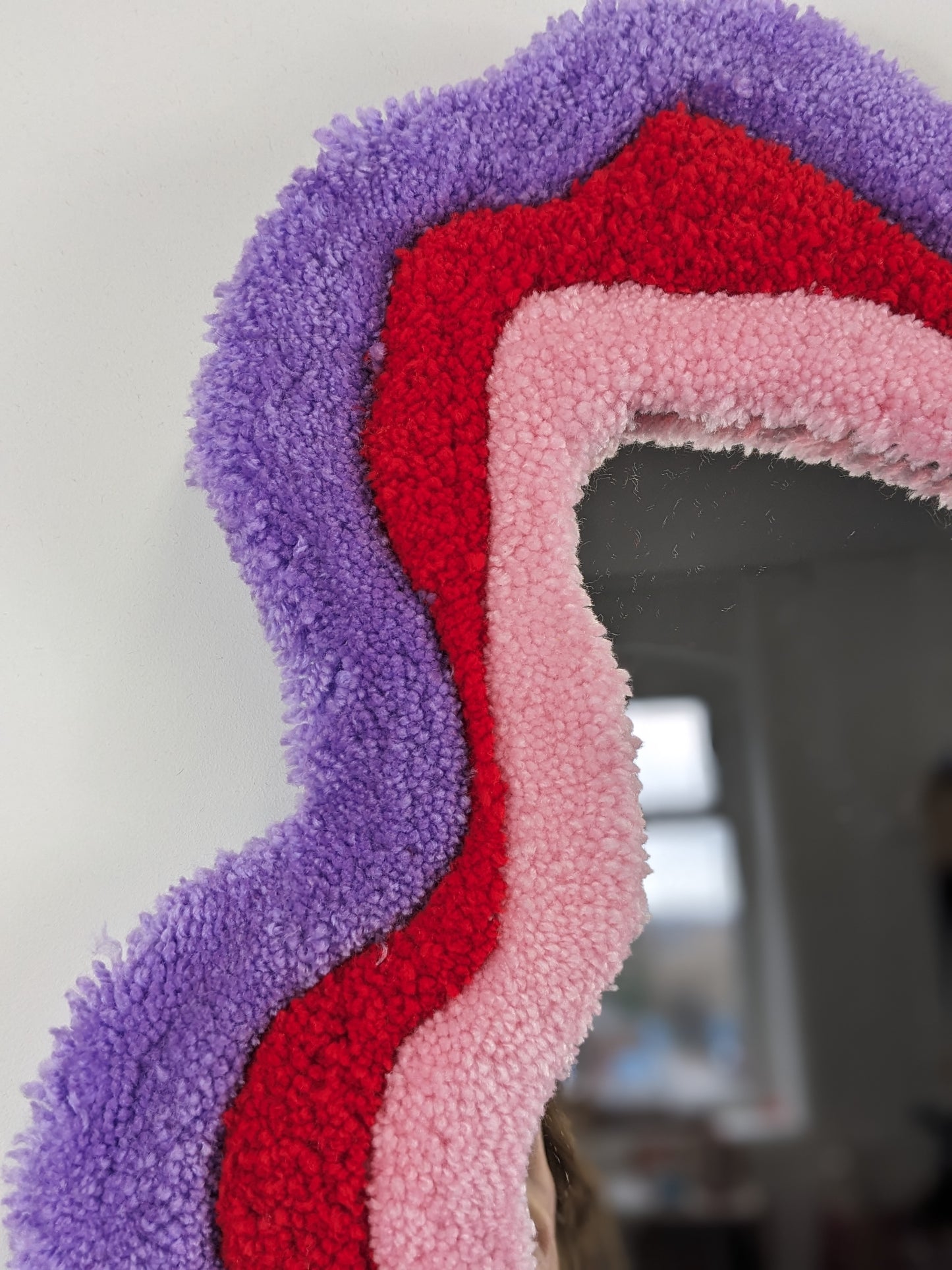 pink red coloured wavy pattern tufted yarn mirror