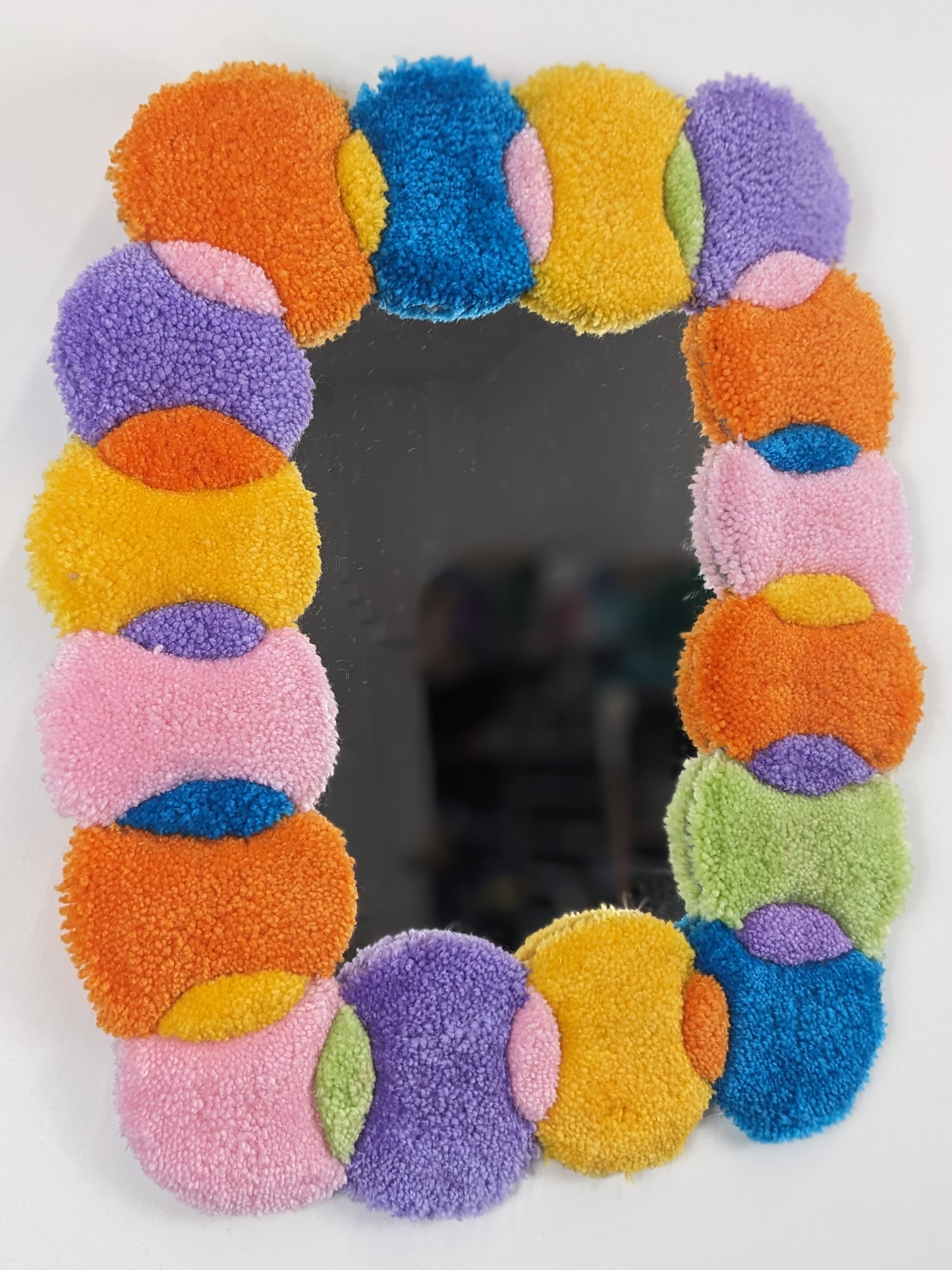 multicoloured orange pastel circle shape pattern yarn tufted mirror