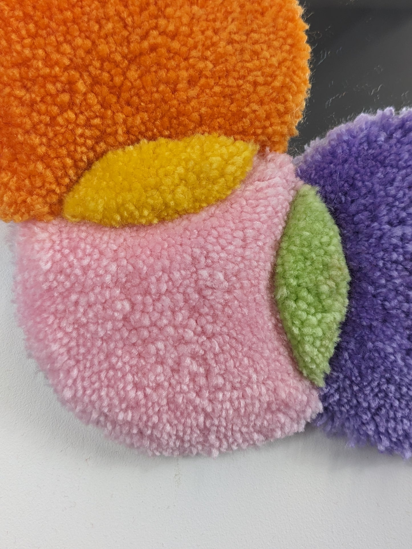 multicoloured orange pastel circle shape pattern yarn tufted mirror