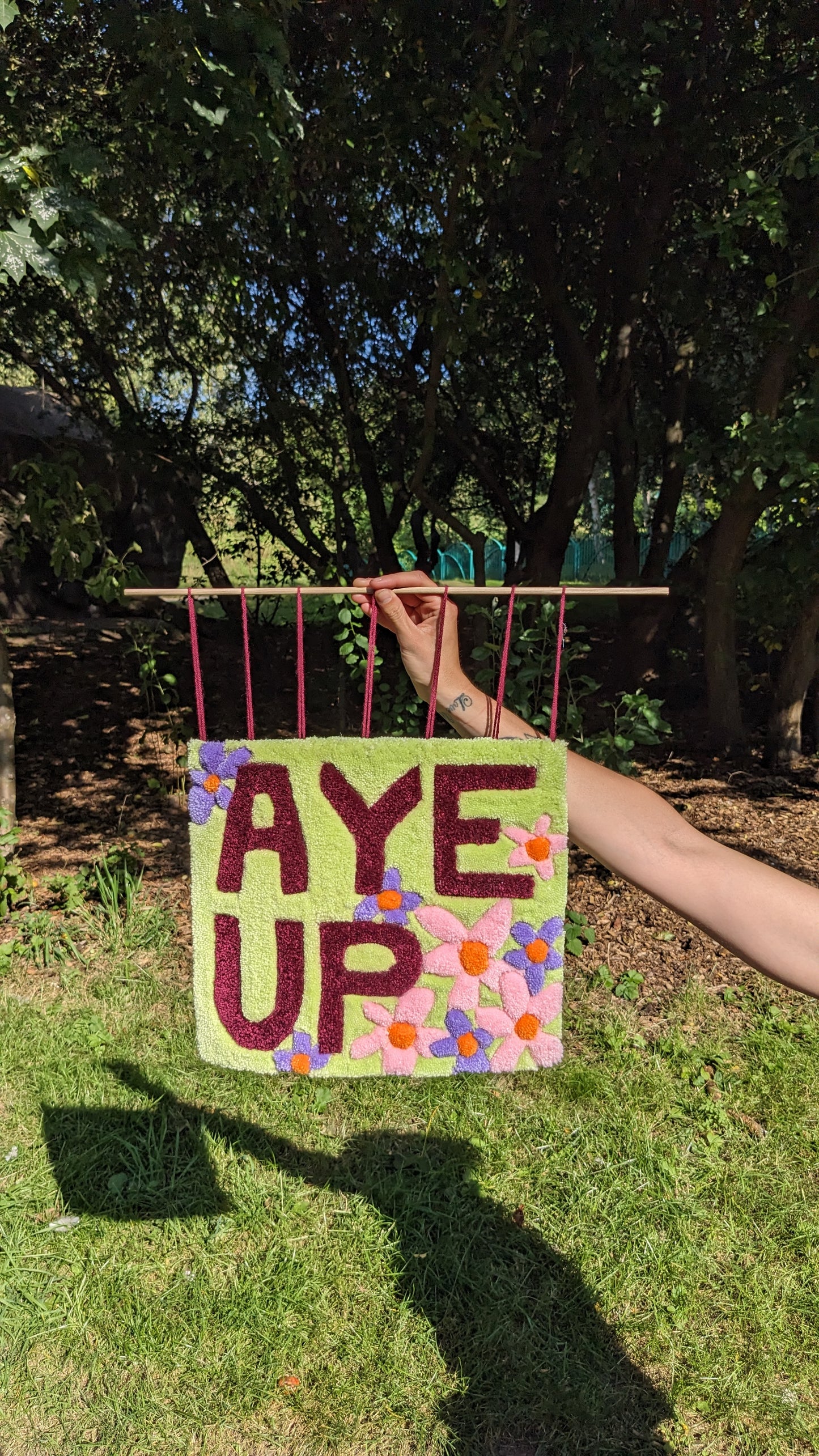 aye up slogan pastel flower wall hanging community garden collection