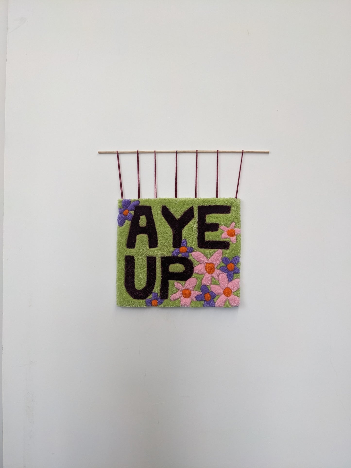 aye up slogan pastel flower wall hanging community garden collection