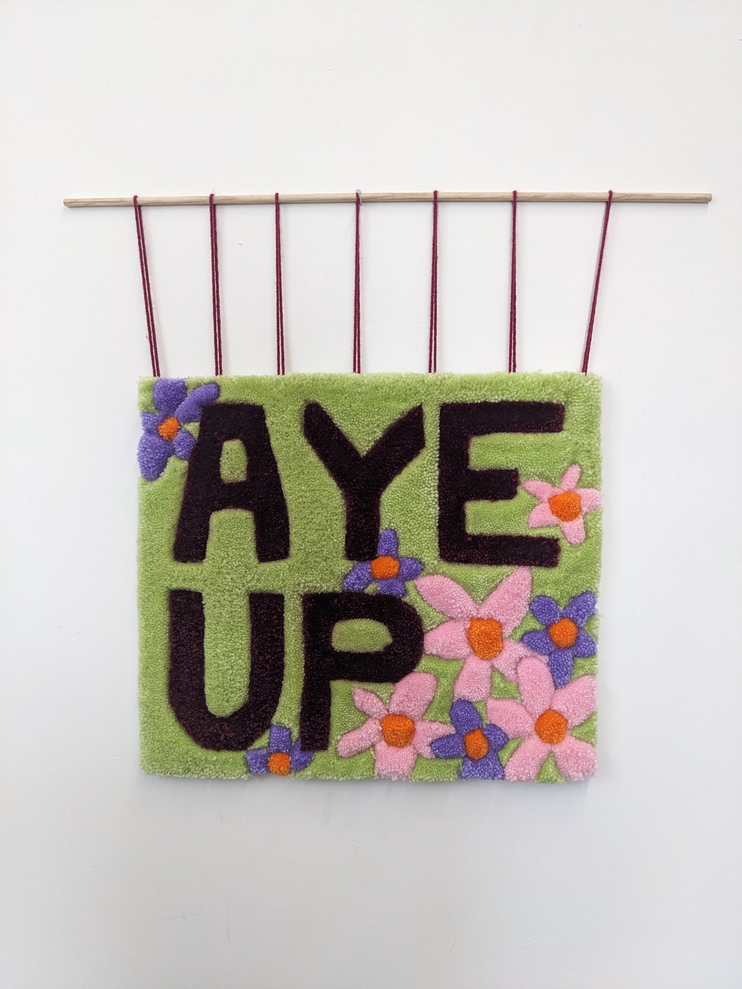 aye up slogan pastel flower wall hanging community garden collection