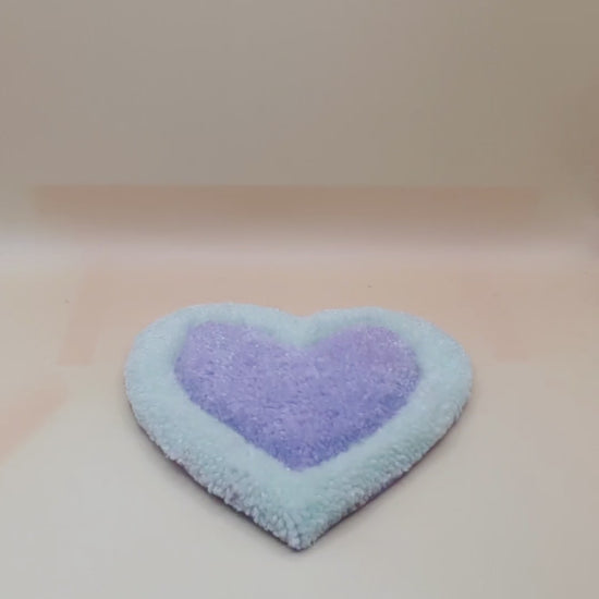 Soft tufted green and purple heart shaped mini rug/coaster 