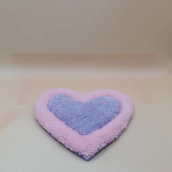 Soft tufted pink and purple heart shaped mini rug/coaster 