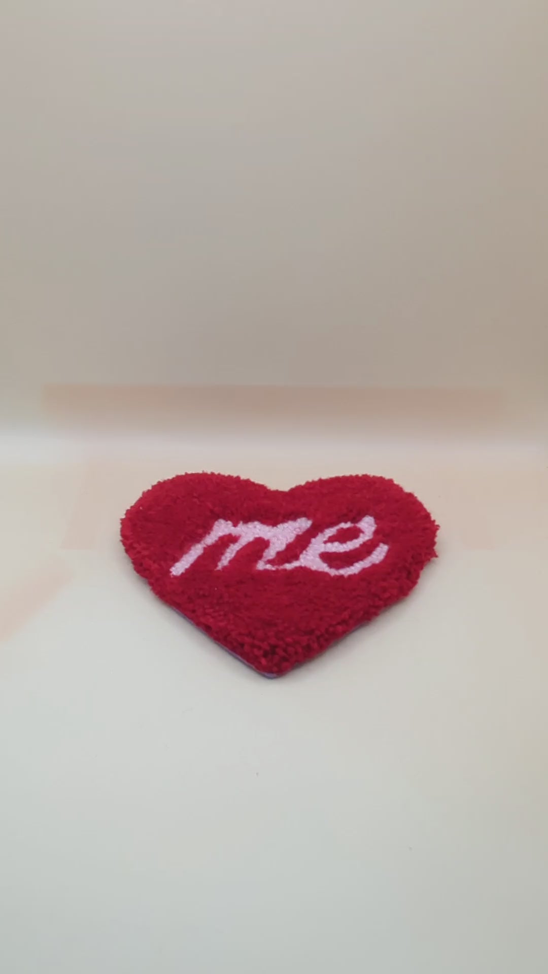 Soft tufted red and pink heart shaped mini rug/coaster with self love slogan